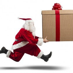 Running Santa Claus with big gift